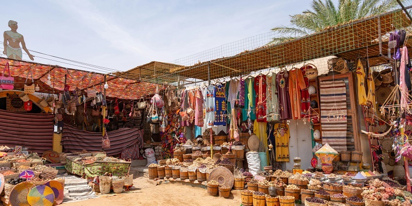 A vibrant traditional shop at the Rani no Hajiro Market showcases colourful Gujarati accessories