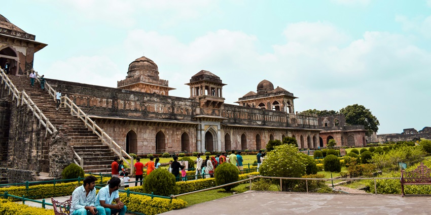 An image showing people walking in a park of Rani Roopmati Pavilion one of the best places to visit in Mandu.