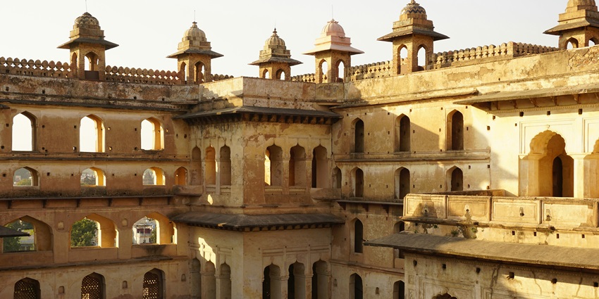 A glimpse of the stunning architecture of the Ranjit Vilas Palace is admired by tourists.