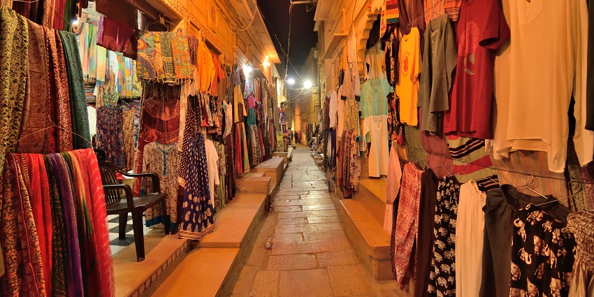 View of a beautiful street at night offering the local style of clothing to all the visitors
