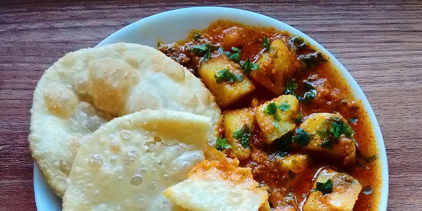 Rasawala Bateta, a traditional Gujarati potato curry, is a famous street food in Rajkot.