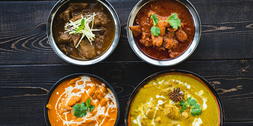 An image of the Rasraj Restaurant offers Rajasthani and Chinese cuisine in a cozy setting.
