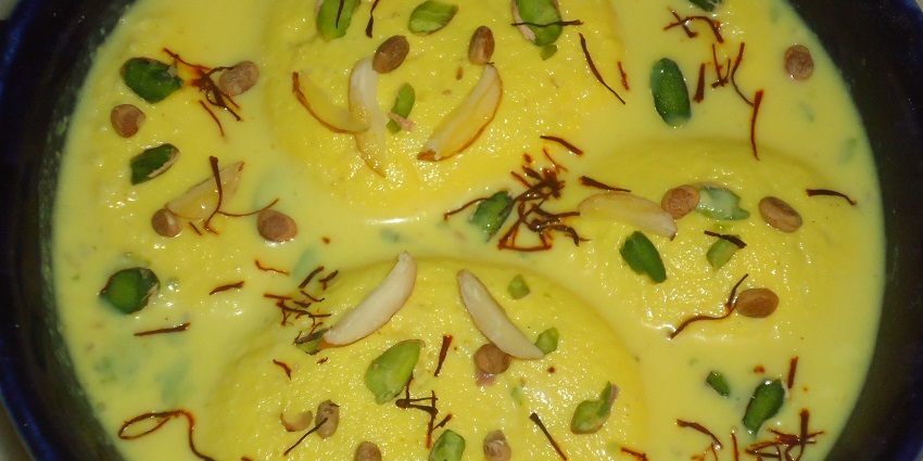 Rassawala Khama, a delicious sweet made from milk served with its sugar syrup and saffron.