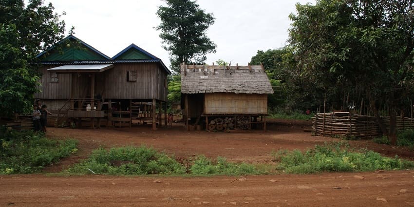 View of the traditional wooden houses on stilts in a rural village in Ratanakiri, Cambodia