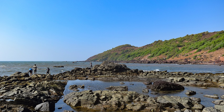 The serene Anjuna Beach is known for its red sands, ravishing nightlife, and hippie culture.