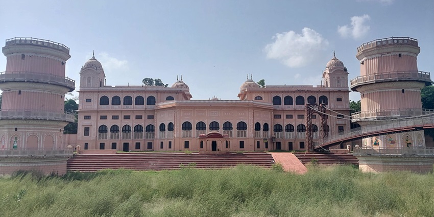 Relax at Lachman Jhoola, built inside the Sheesh Mahal complex amidst lush gardens.