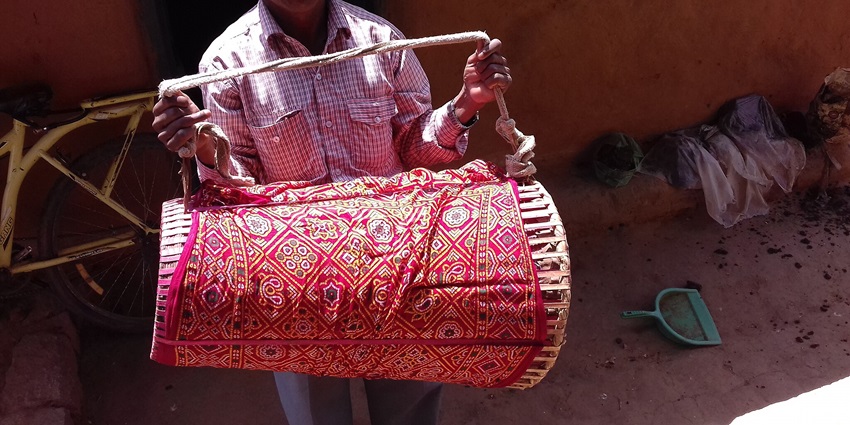 Man holding a musical instrument of Asur Tribe of Jharkhand during cultural festival