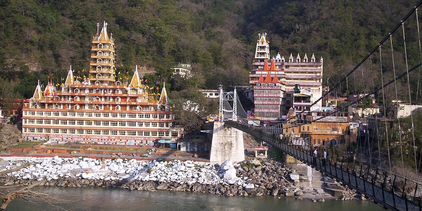 A picture of the stunning ghats on the bank of River Ganga as seen from the iconic Lakshman Jhula