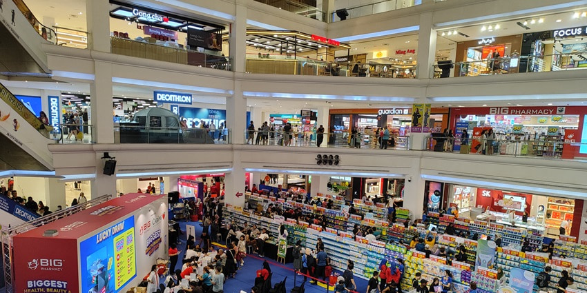 A picture of the Rising Mall in Kathmandu with numerous staple stores and numerous buyers