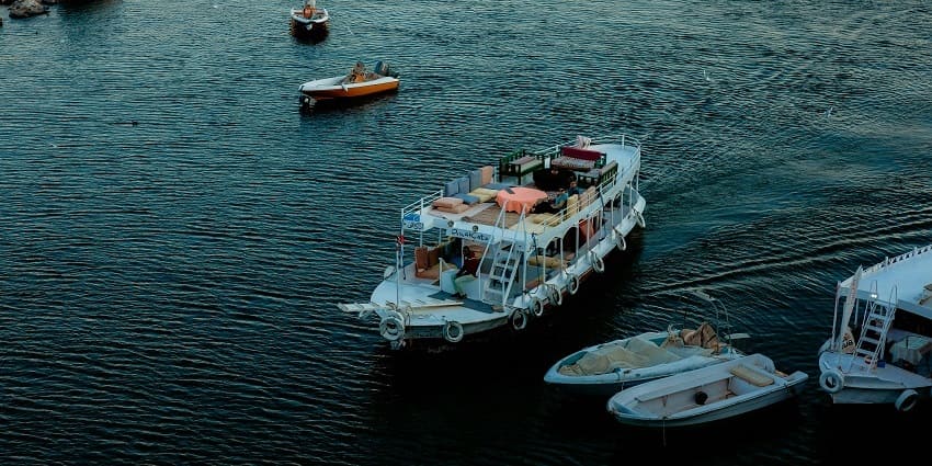 A breathtaking aerial view of a water body with cruises on top of it during the daytime.