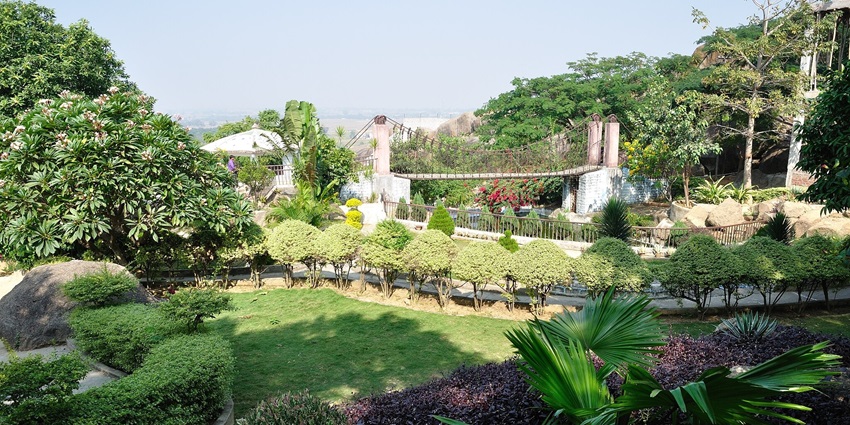 Suspension bridge at Gonda Hill in Ranchi, crossing over a green landscape with hills
