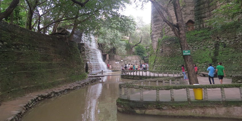 View of lush environment of the rock garden with tourist exploring all around