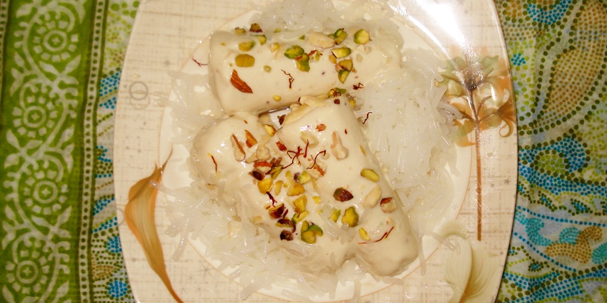 Punjabi Kulfi served on a plate sprinkled with different nuts, a refreshing snack for sweet tooths