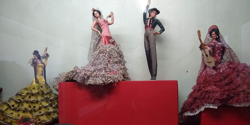 Dolls in various poses exhibited at the Rotary Midtown Dolls Museum in Gujarat