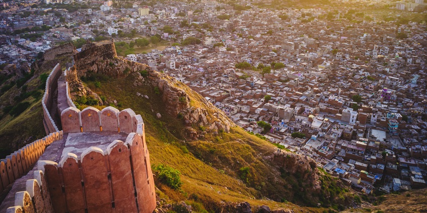 A panoramic view capturing the sprawling cityscape, historic architecture, and the surrounding hills
