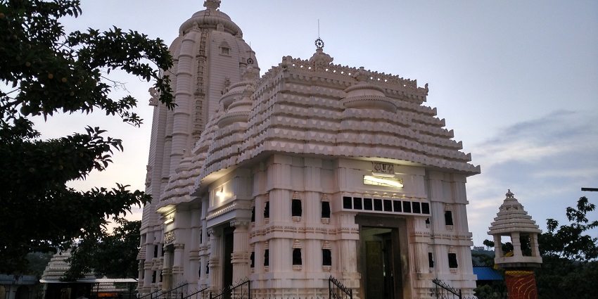 Front view of Sabara Shri Khetra with its intricate architecture and surrounding greenery