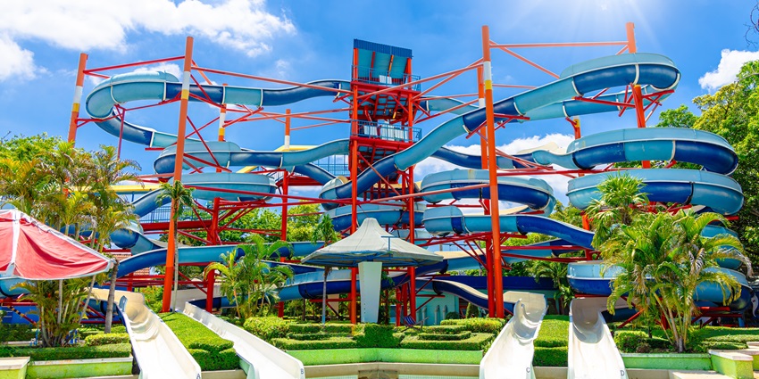 Image of adventurous water slides with twisty ways under clear blue sky during day time