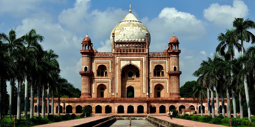 A breathtaking vista of the Safdarjung Tomb steeped in red shade and rustic allure.