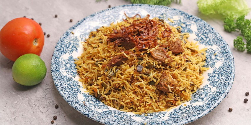 A thali of biryani, a fulfilling dish servable to both veg and non veg lovers
