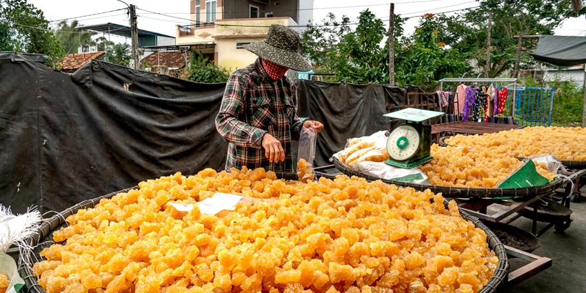A vendor of sweets in one of the harvest festivals of Himachal Pradesh in India.