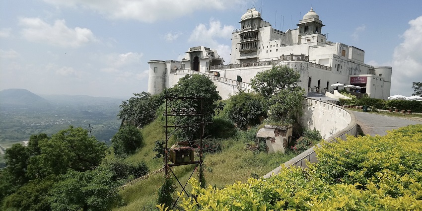 A glimpse of the majestic Sajjangarh Fort situated amidst greenery on the top of the hill.