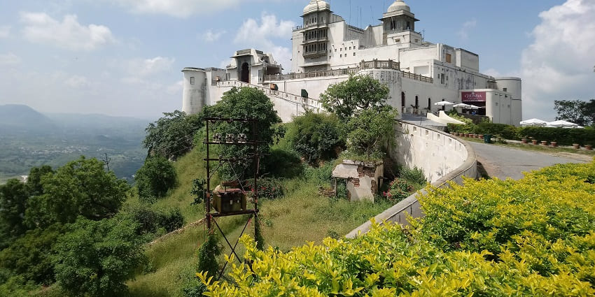 Monsoon Palace, perched on a hill with panoramic views of the city, lakes, and landscape