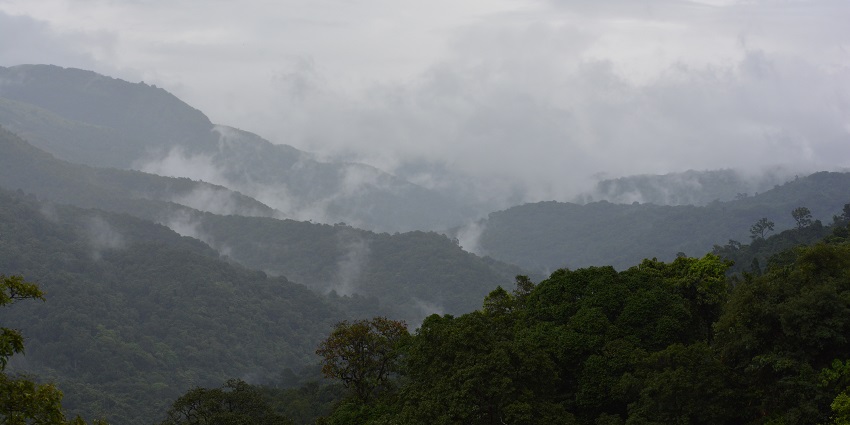 A panoramic view of Sakleshpur hill station, surrounded by clouds.