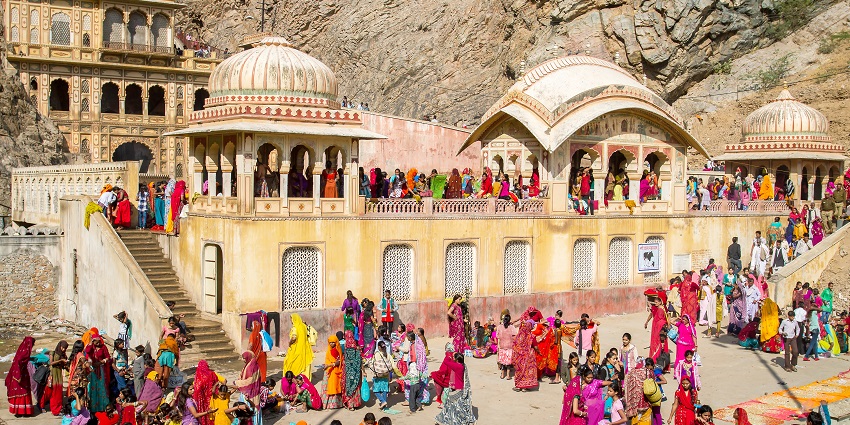A picture of devotees waiting in a queue to visit the Balaji temple and seek blessings from the deity