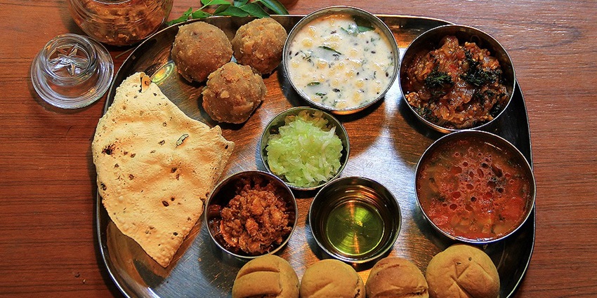 Santosh Bhojanalay serves the best food in Udaipur, offering authentic Rajasthani thali.