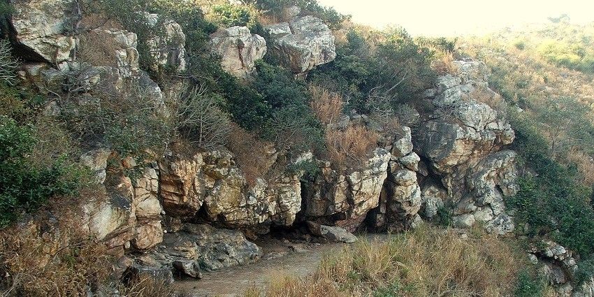 View of Saptaparni Caves, perched on a hill, with the landscape of Rajgir spread out in the background