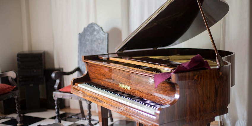 A music instrument, giant piano with chair put on display at the acclaimed Sarod Ghar.