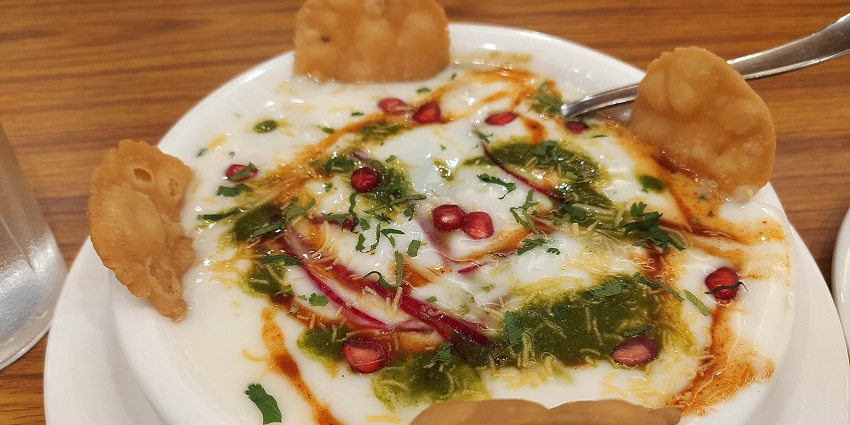 Enjoying a delicious plate of food at a restaurant in Haryana is a must-do when visiting.