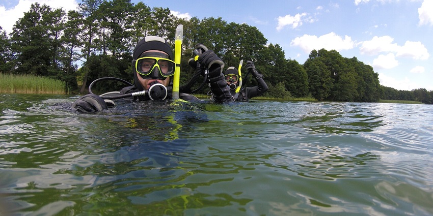 Scuba diver relaxing on the surface of Sulu sea after a tiring round of this amazing water sport.