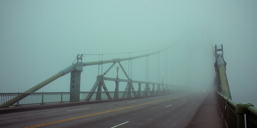 A view of the haunted bridge covered in fog, one of the top haunted places in Chandigarh.