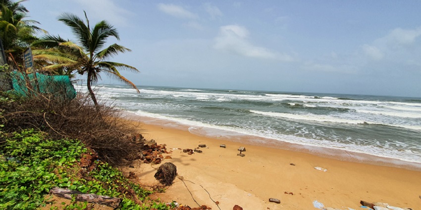 Clear and clean view of the Sernabatim beach under the scenic sunny sky of tropical Goa