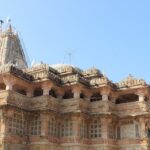 Picturesque view of the Shamlaji temple with tourists walking in and out of the building