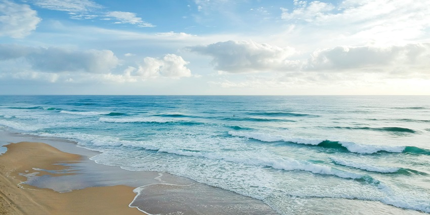 Shangumugham Beach, a serene coastal destination with golden sands and gentle waves