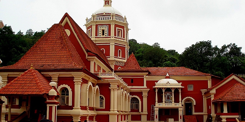A captivating view of Shantadurga Temple with breathtaking red and white architecture.