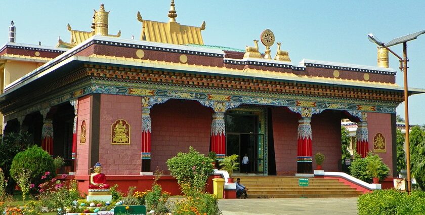 A peaceful view of Shechen monastery in Bodhgaya, Nepal, India, surrounded by trees.