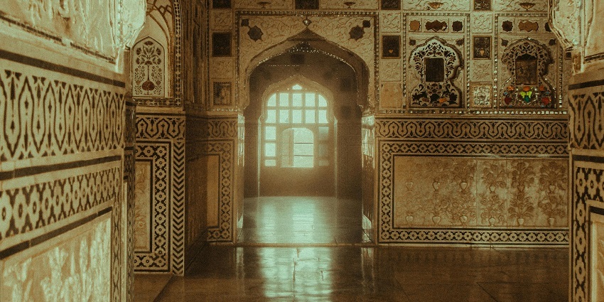 The interior of Sheesh Mahal is adorned with mirror work and royal heritage decor.