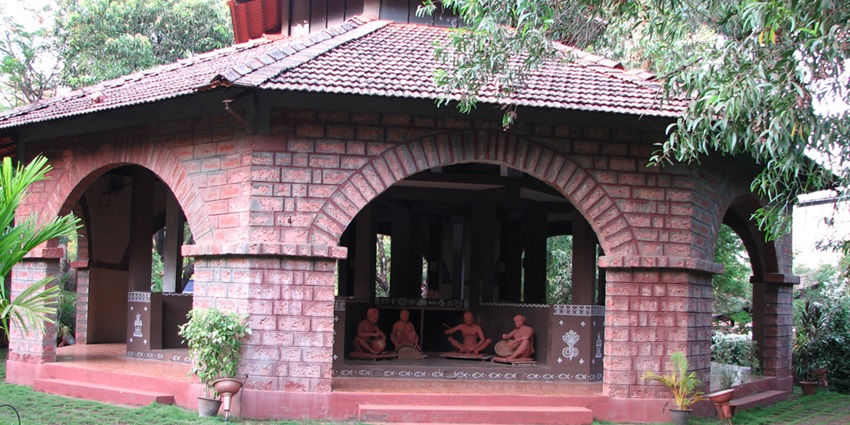 Traditional artisan huts and entrance gate at Shilpgram craft village, Udaipur.