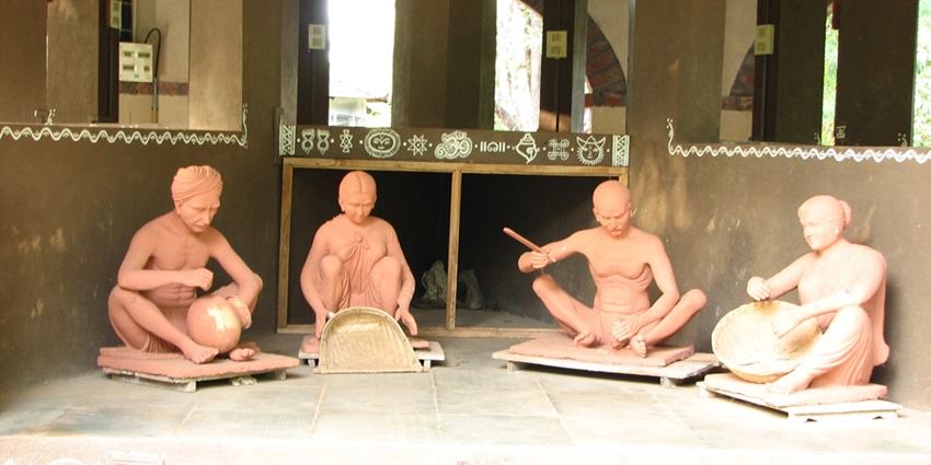 Image of villagers statue designed making handcrafted items in Shilpgram - a popular tourist place