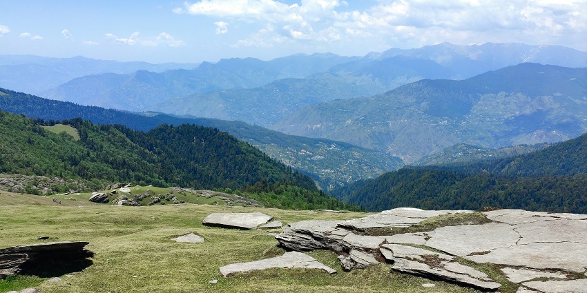Picturesque view of Shimla hills with twisty road and trains under clear blue sky