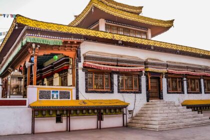 A stunning view of a monastery in Himachal Pradesh with colourful architecture in the day.