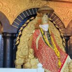 A mesmerising view of the idol of Sai Baba adorned with beautiful clothes and jewellery.