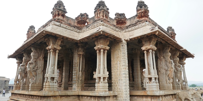 A picture of a historical Shiva Temple in Delhi with intricate carvings on pillars