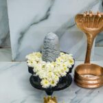 Shivling temple with gold accessories, featuring a sleek, modern design - Surutapalli temple.