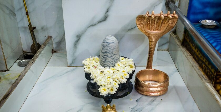 Shivling temple with gold accessories, featuring a sleek, modern design - Surutapalli temple.