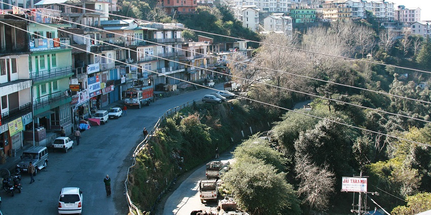 Beautiful view of Shoghi town and road with busy twisty road and building on top of the hill