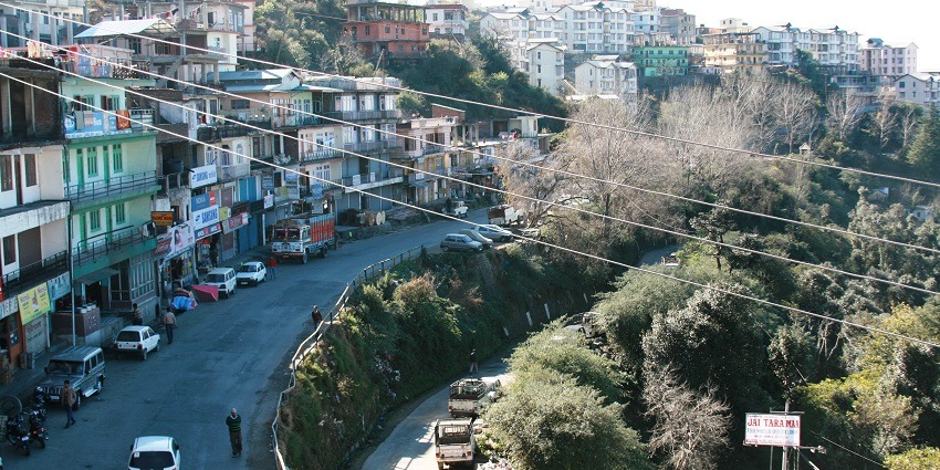 View from top of the mountains Shoghi town and twisty road surrounded by greenery